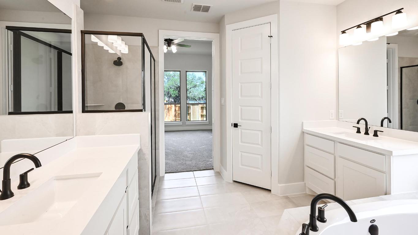 368 Prickly Poppy Loop Kyle, TX 78640 - Photo 14 of 39 Full bath featuring a stall shower, tile patterned floors, two vanities, a ceiling fan, and a tub with jets