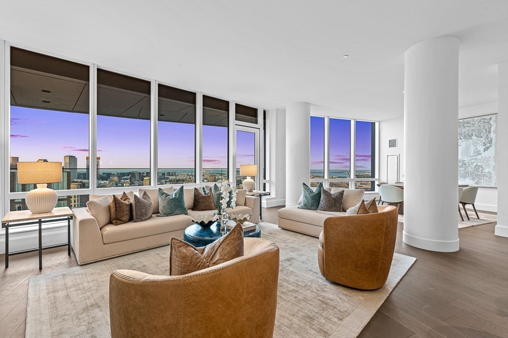 40 Trinity Place, Unit PH35D Boston, MA 02116 - Photo 12 of 40 a living room with furniture kitchen view and large windows