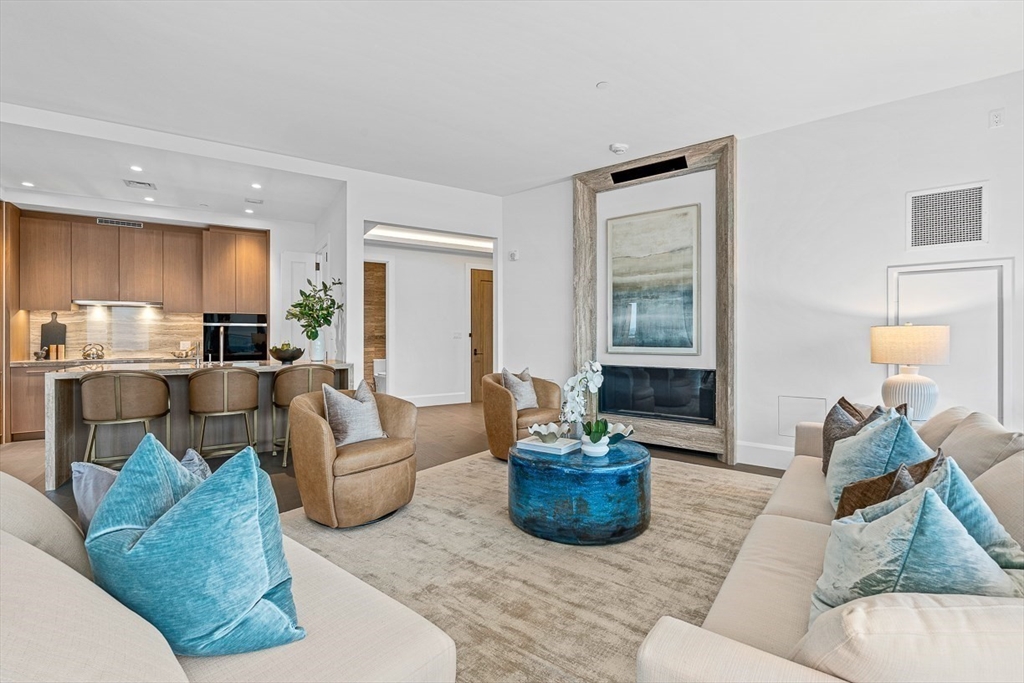 40 Trinity Place, Unit PH35D Boston, MA 02116 - Photo 15 of 40 a living room with furniture and a potted plant