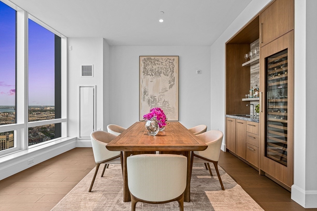 40 Trinity Place, Unit PH35D Boston, MA 02116 - Photo 17 of 40 a view of a dining room with furniture window and wooden floor