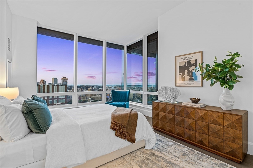 40 Trinity Place, Unit PH35D Boston, MA 02116 - Photo 19 of 40 a bedroom with furniture and a large window