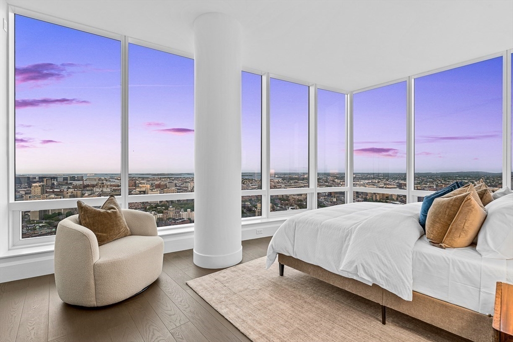 40 Trinity Place, Unit PH35D Boston, MA 02116 - Photo 26 of 40 a bedroom with a bed and glass window