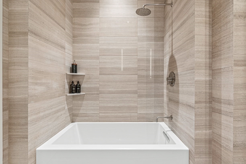 40 Trinity Place, Unit PH35D Boston, MA 02116 - Photo 35 of 40 a close view of a bathtub in bathroom