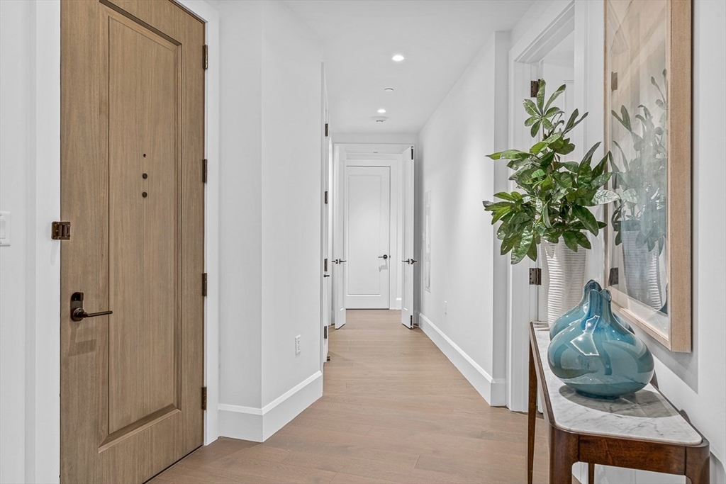 40 Trinity Place, Unit PH35D Boston, MA 02116 - Photo 36 of 40 a hallway with painting and a potted plant