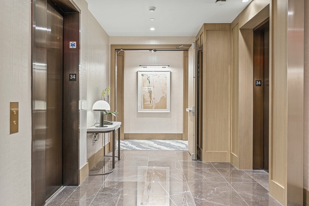 40 Trinity Place, Unit PH35D Boston, MA 02116 - Photo 40 of 40 a bathroom with a sink and a mirror