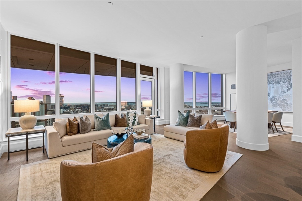 40 Trinity Place, Unit PH35D Boston, MA 02116 - Photo 5 of 40 a living room with furniture potted plant and a large window