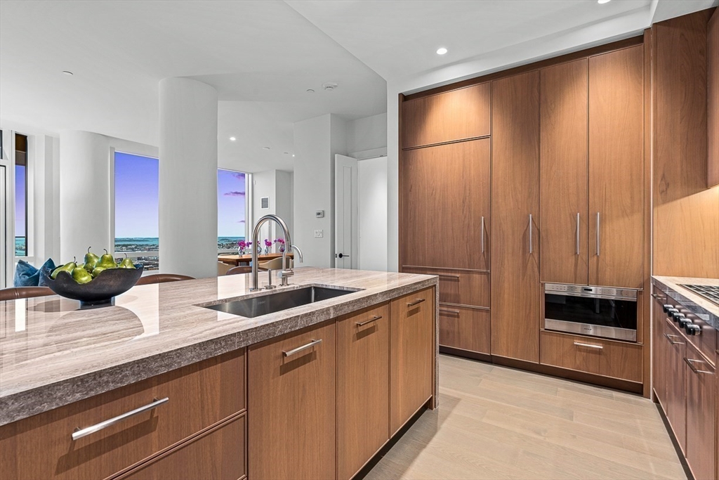 40 Trinity Place, Unit PH35D Boston, MA 02116 - Photo 8 of 40 a kitchen with a sink and a refrigerator