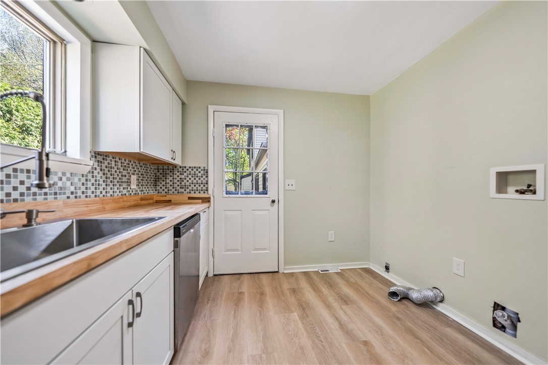 321 Eaglehead Road Perinton, NY 14445 - Photo 28 of 48 Secondary unit kitchen with 1st floor laundry hook