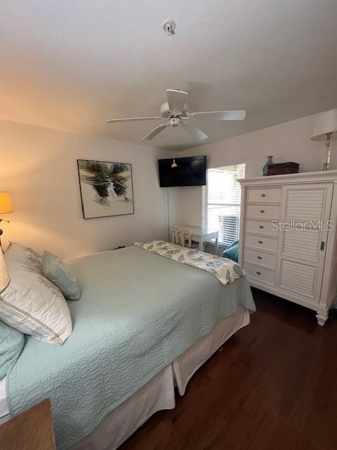 5270 Hyland Hills Avenue, Unit 1724 Sarasota, FL 34241 - Photo 15 of 35 a bedroom with a bed and cabinets