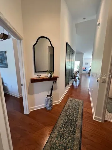 a view of an entryway with wooden floor