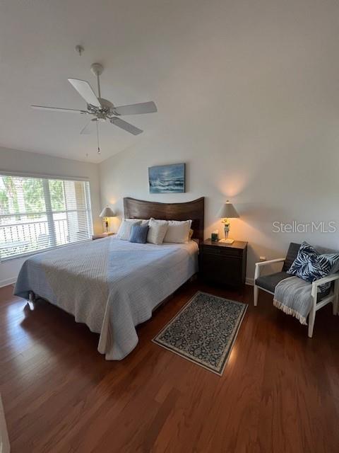 5270 Hyland Hills Avenue, Unit 1724 Sarasota, FL 34241 - Photo 21 of 35 a bedroom with a bed rug and window