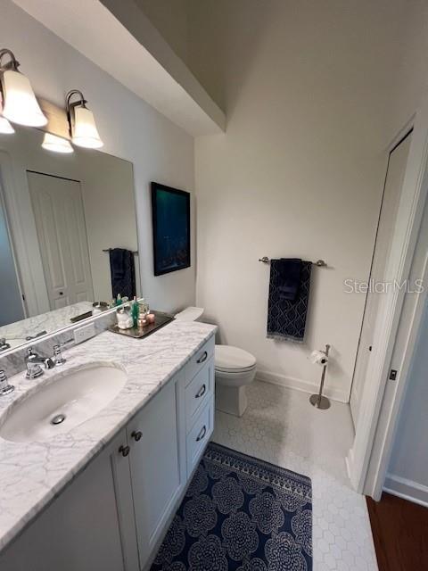 5270 Hyland Hills Avenue, Unit 1724 Sarasota, FL 34241 - Photo 23 of 35 a spacious bathroom with a double vanity sink toilet mirror and bathtub