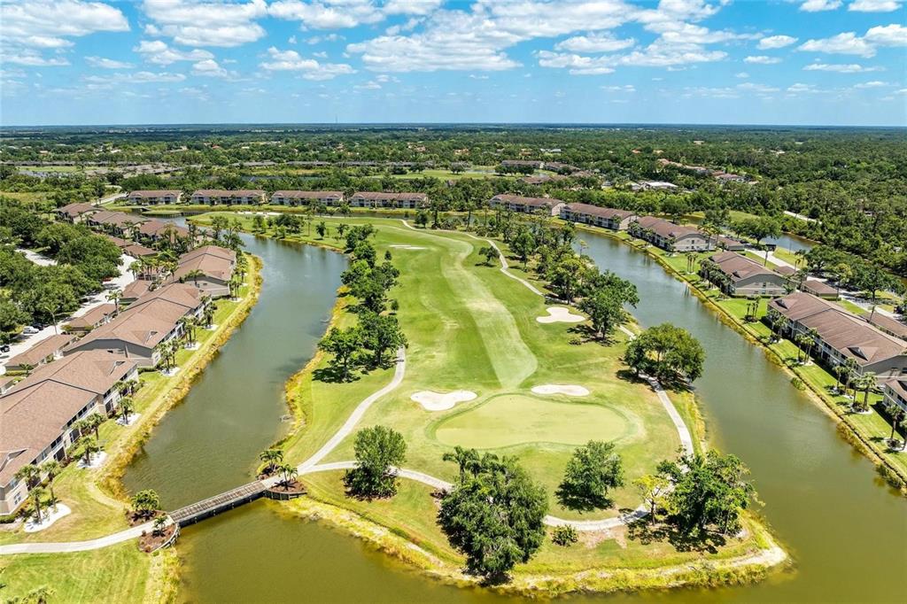 5270 Hyland Hills Avenue, Unit 1724 Sarasota, FL 34241 - Photo 30 of 35 an aerial view of residential houses with outdoor space