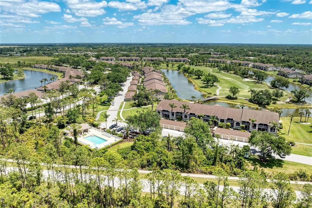 5270 Hyland Hills Avenue, Unit 1724 Sarasota, FL 34241 - Photo 31 of 35 an aerial view of residential houses with outdoor space