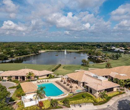 5270 Hyland Hills Avenue, Unit 1724 Sarasota, FL 34241 - Photo 35 of 35 an aerial view of residential house with outdoor space and lake view