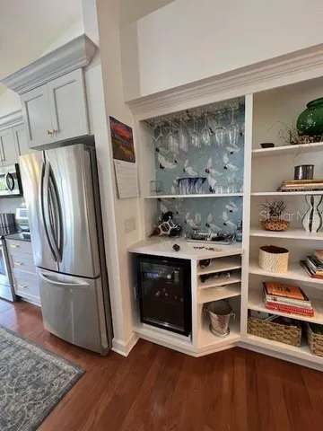 a kitchen with stainless steel appliances a stove and a refrigerator