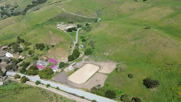 a bathroom with a granite countertop sink and mirror