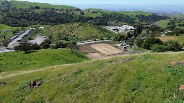 an aerial view of residential house with outdoor space