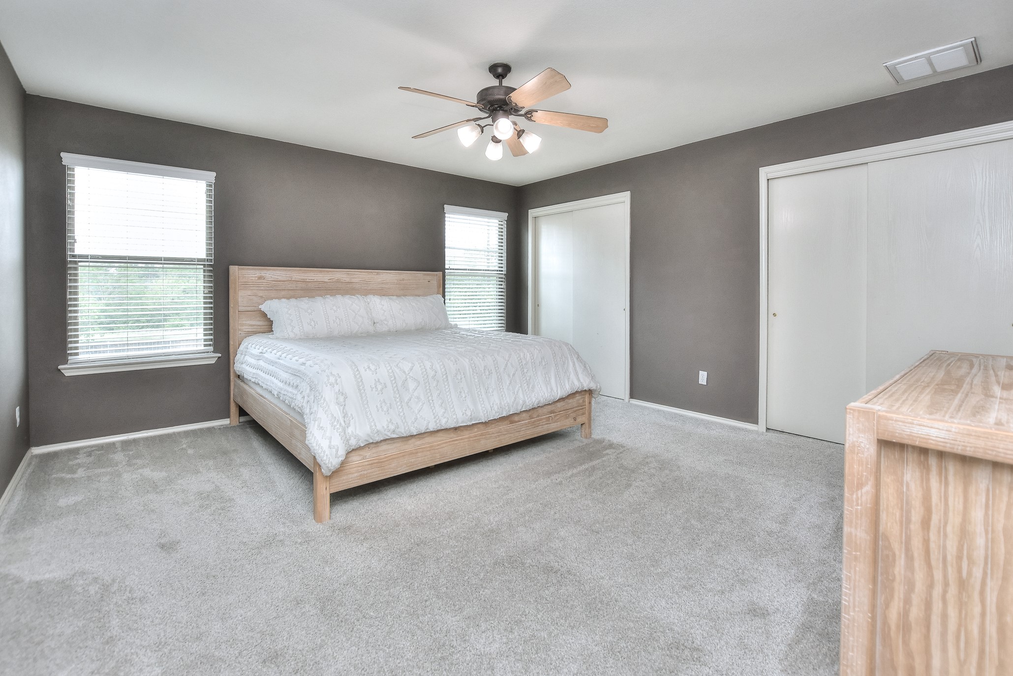 74 Jan Lane Georgetown, TX 78626 - Photo 23 of 31 a bedroom with a large bed and a chandelier
