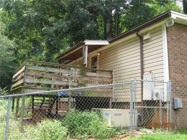 1901-1905 Little Road Reidsville, NC 27320 - Photo 2 of 16 Exterior Front. Rear of Home with Deck and fence