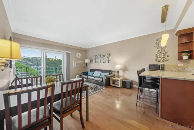 a view of a balcony with an outdoor seating