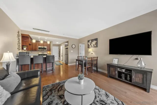 a bedroom with furniture and a potted plant