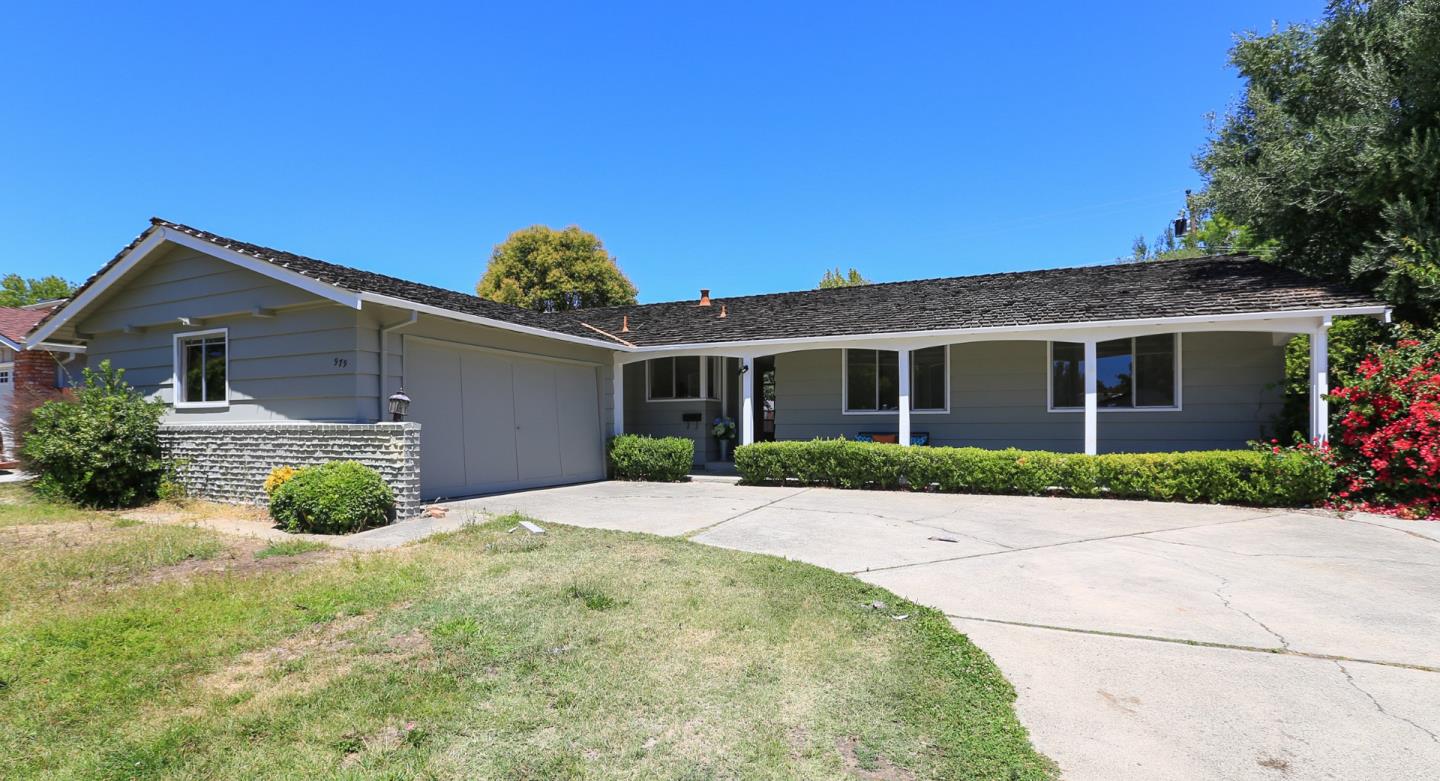 979 West Homestead Road Sunnyvale, CA 94087 - Photo 1 of 16 a front view of a house with a yard and garage
