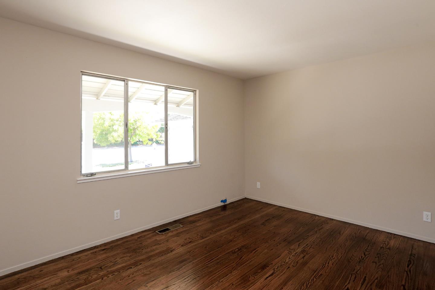 979 West Homestead Road Sunnyvale, CA 94087 - Photo 13 of 16 a view of empty room with wooden floor and fan