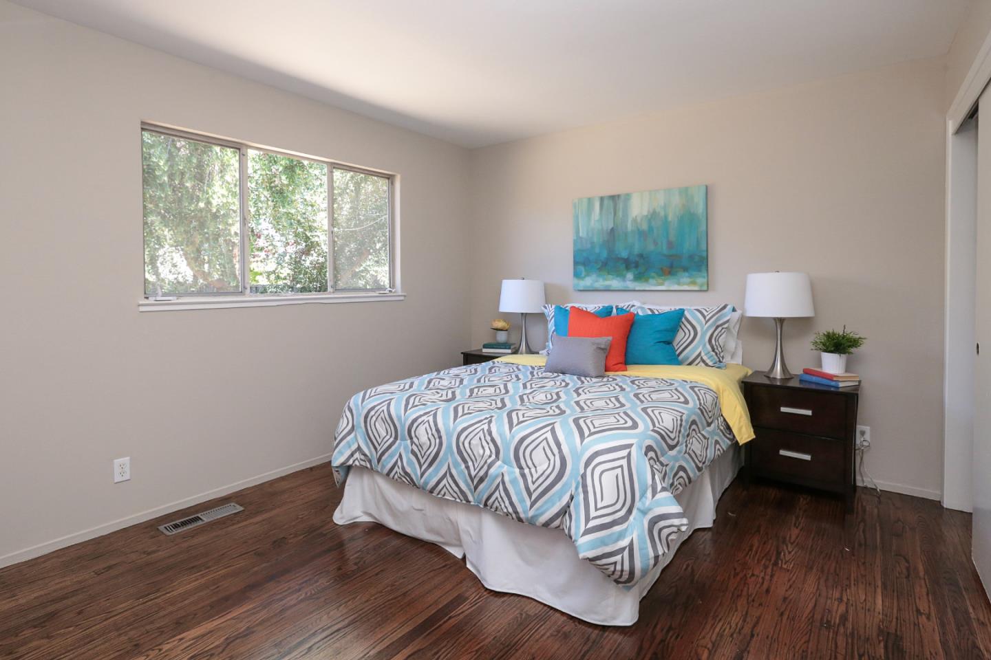 979 West Homestead Road Sunnyvale, CA 94087 - Photo 15 of 16 a bedroom with a bed and wooden floor