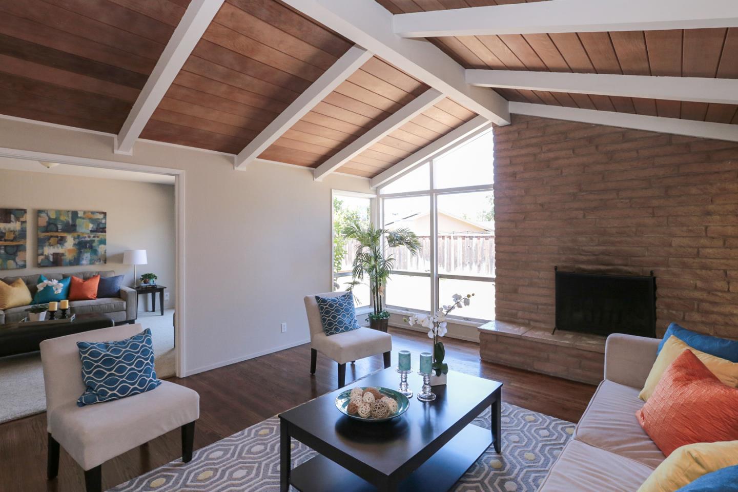 979 West Homestead Road Sunnyvale, CA 94087 - Photo 3 of 16 a living room with furniture and a fireplace