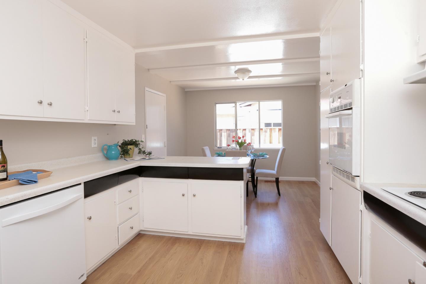 979 West Homestead Road Sunnyvale, CA 94087 - Photo 8 of 16 a kitchen with a sink and cabinets
