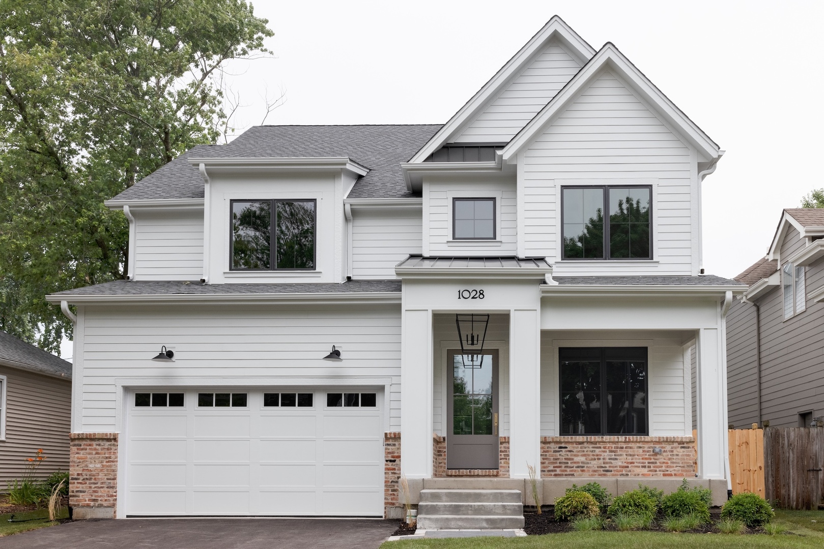 905 North Webster Street Naperville, IL 60563 - Photo 2 of 13 a view of a white house with large windows