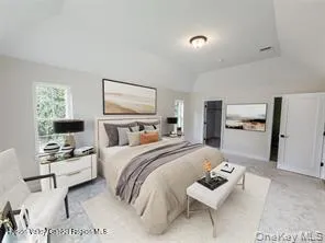 a bedroom with a bed and a couch