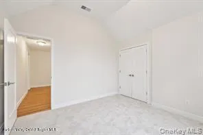 a bathroom with a window a toilet and a shower