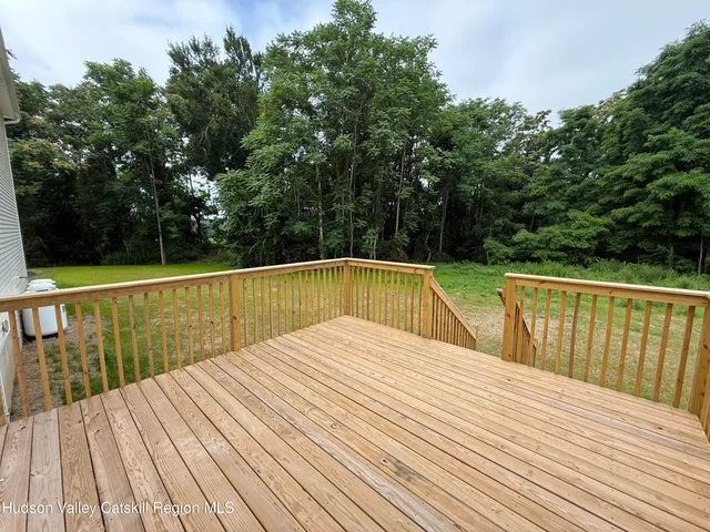 a view of dirt yard with a trees