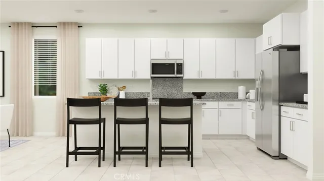 a kitchen with a cabinets and appliances