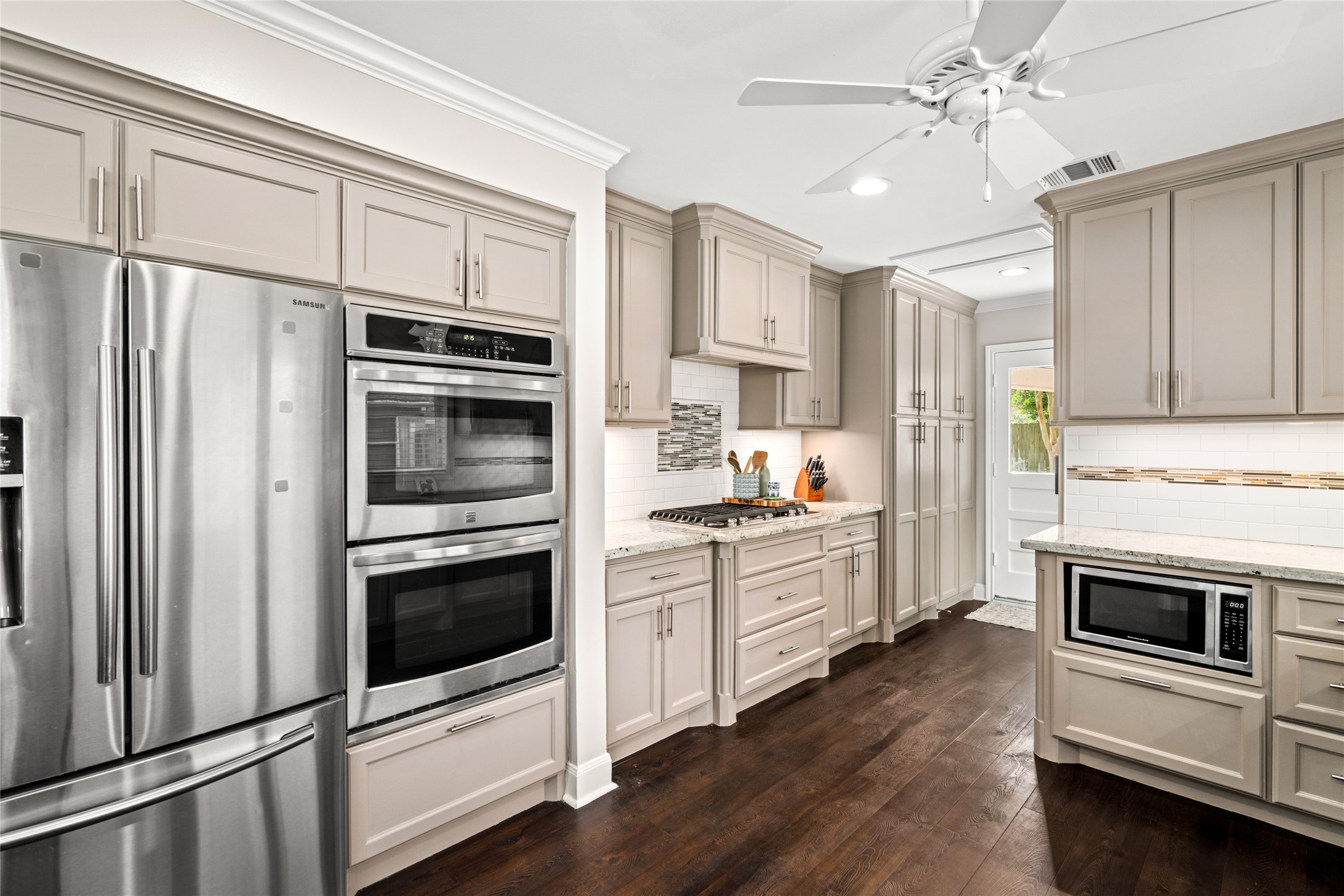 7805 Valley View Lane Houston, TX 77074 - Photo 1 of 29 a kitchen with stainless steel appliances a stove a sink and a refrigerator