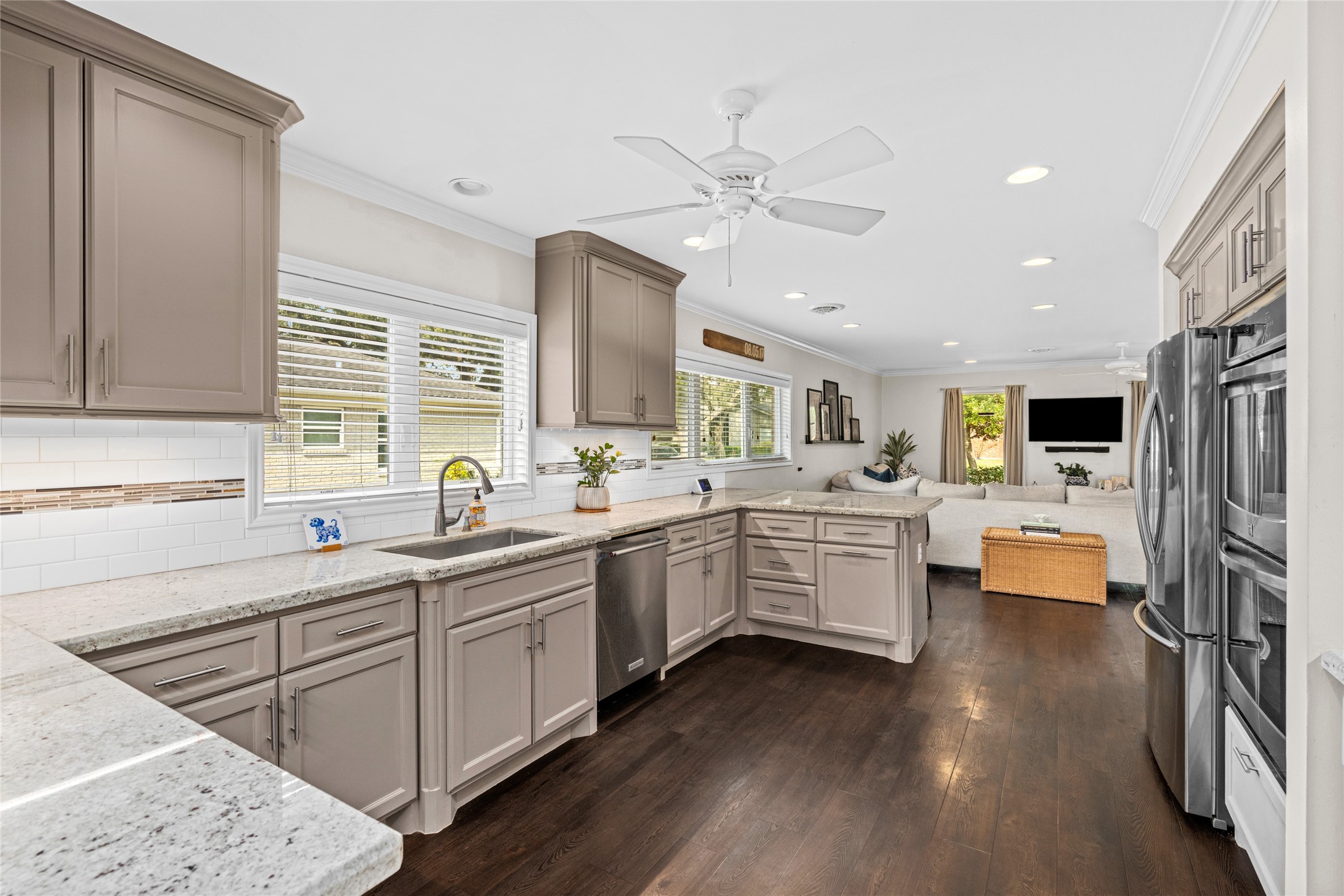 7805 Valley View Lane Houston, TX 77074 - Photo 13 of 29 a kitchen with white cabinets and sink