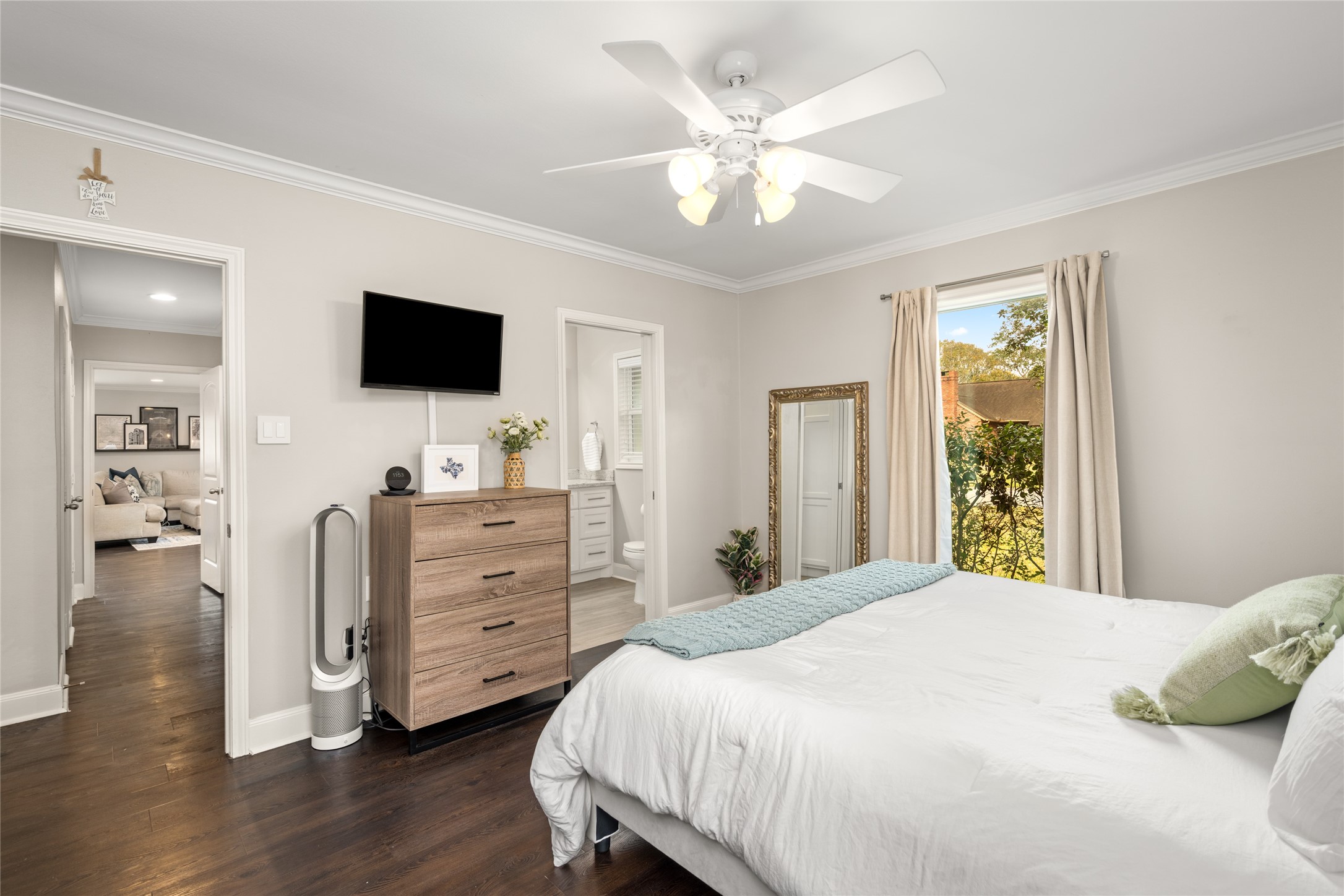 7805 Valley View Lane Houston, TX 77074 - Photo 14 of 29 a bedroom with a bed and a flat screen tv
