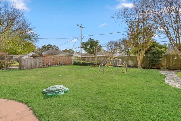 a front view of a house with a yard table and chairs