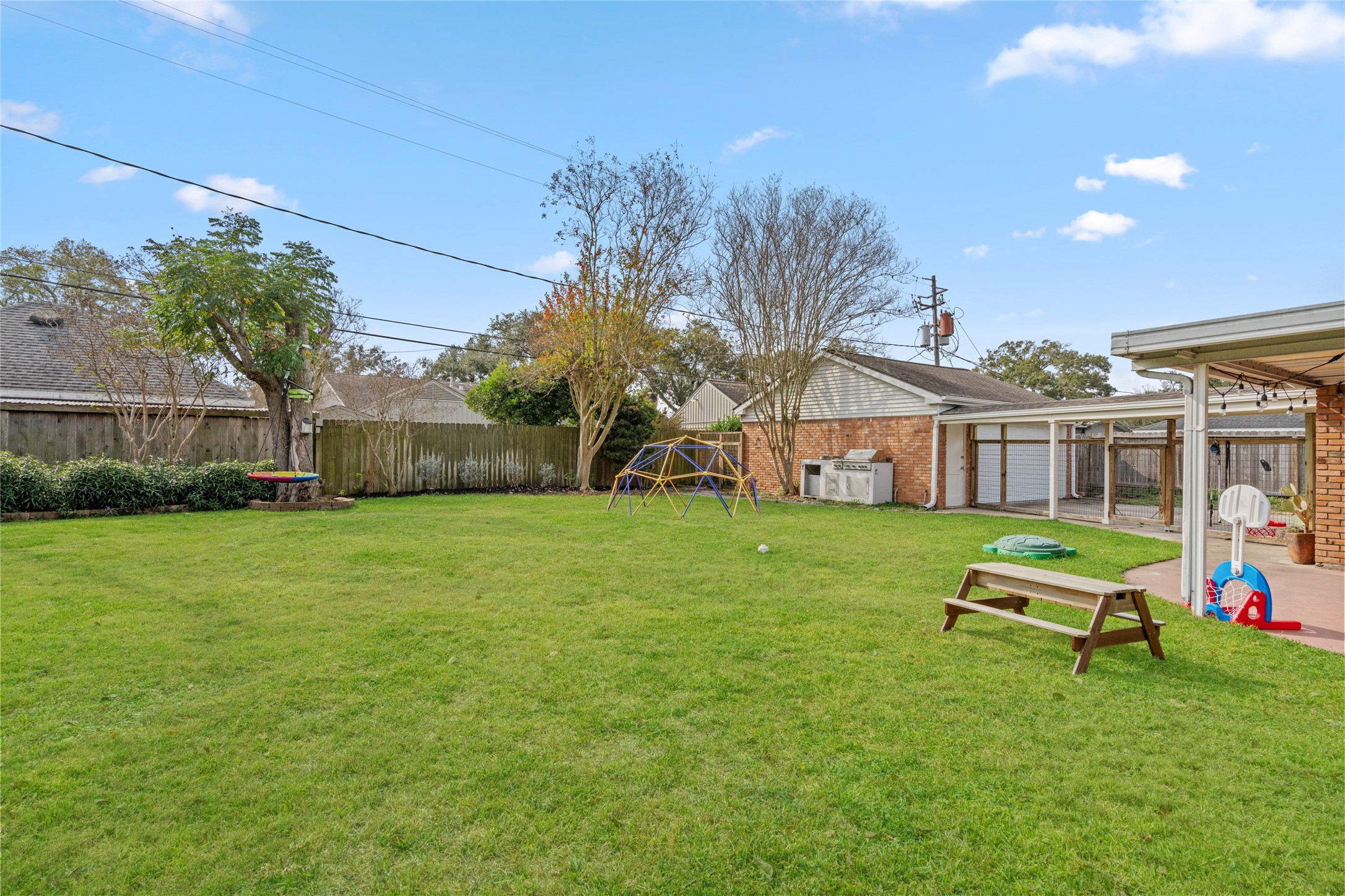 7805 Valley View Lane Houston, TX 77074 - Photo 24 of 29 a front view of a house with a yard table and chairs