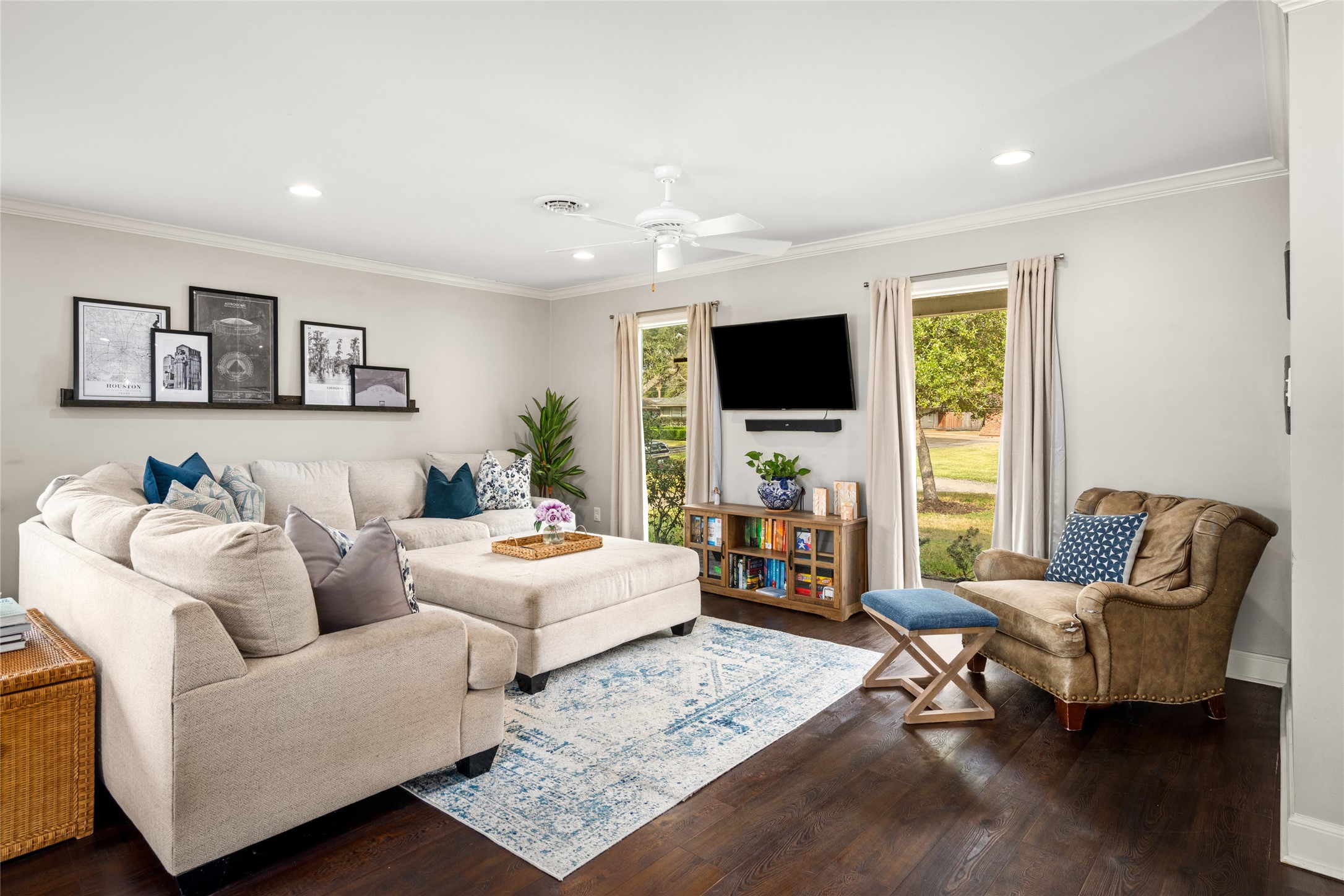 7805 Valley View Lane Houston, TX 77074 - Photo 5 of 29 a living room with furniture a flat screen tv and a window