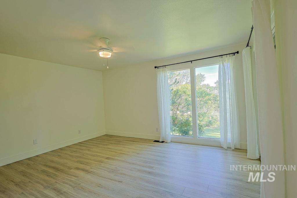 640 Morrison Street Twin Falls, ID 83301 - Photo 17 of 30 Spacious room with wood-finish flooring and a contemporary ceiling fan with integrated lighting