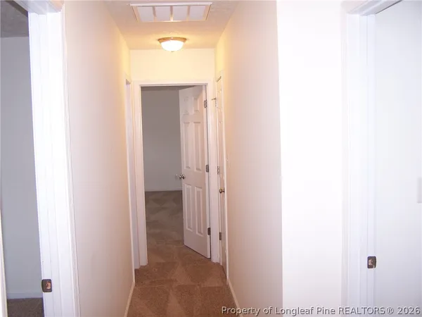a view of a bathroom from a hallway
