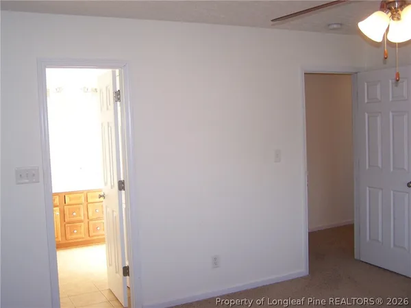 view of an empty room and a window