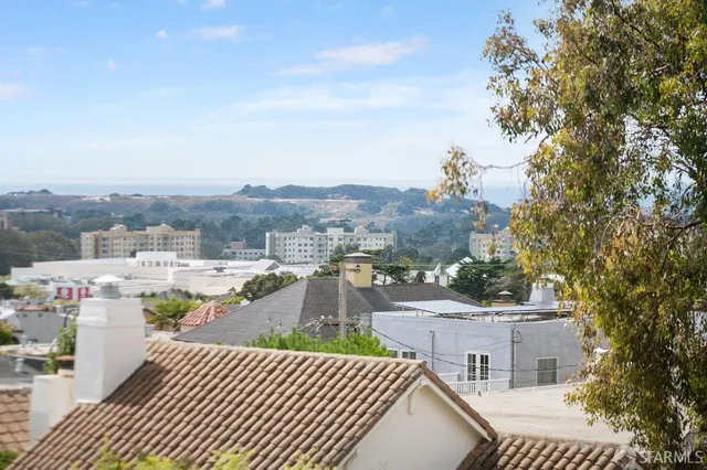 a backyard of a house with lots of green space and fog