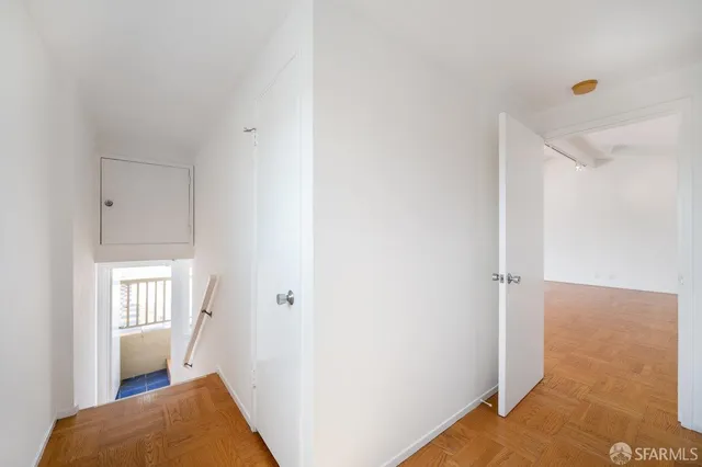 a view of an empty room with windows