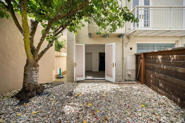 a white toilet sitting next to a bathroom sink