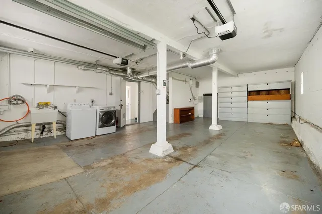 a view of water heater room with wooden floor