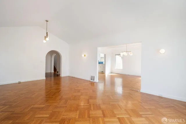 a view of a kitchen with a dishwasher cabinets and a wooden floor